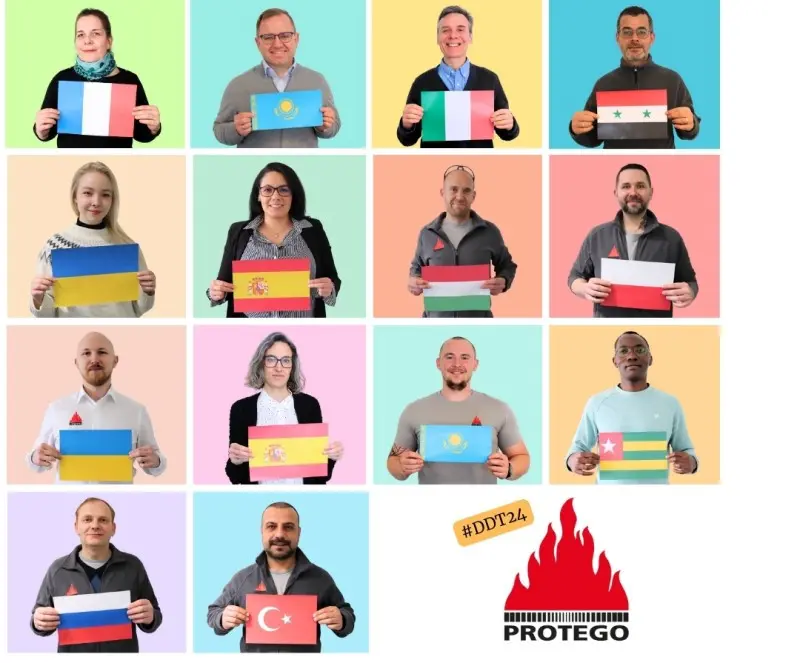 A grid collage of staff portraits on colorful backgrounds shows people holding different national flags, alongside the hashtag “#DDT24” and the PROTEGO flame logo.